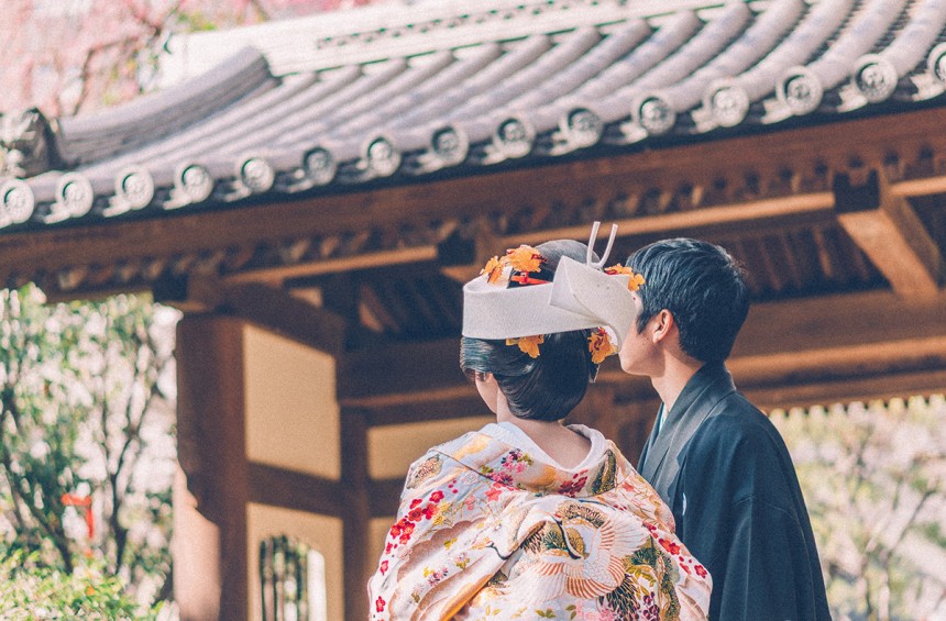 Newlyweds Having Their Photo Taken in a Garden