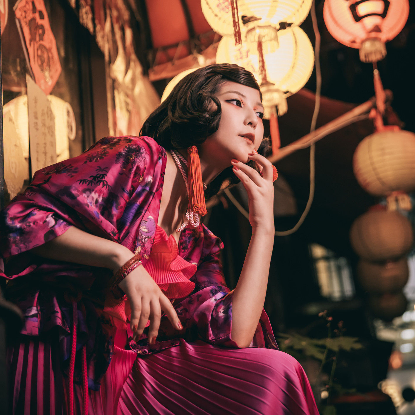 a magenta coat combined with a dress resembling traditional japanese fashion with a modernized touch