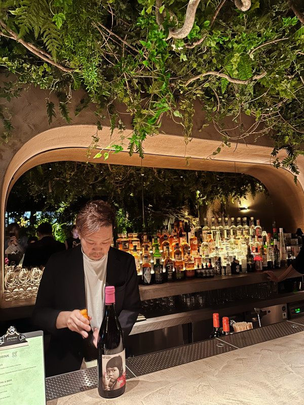 Bartender with a bottle of natural wine