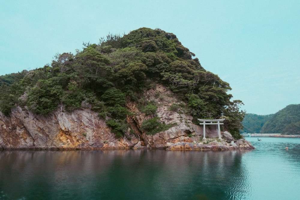 Torii gate in the water on Gongenjima in Uryu Harbor, annex of Hinomisaki Jinja in Shimane.