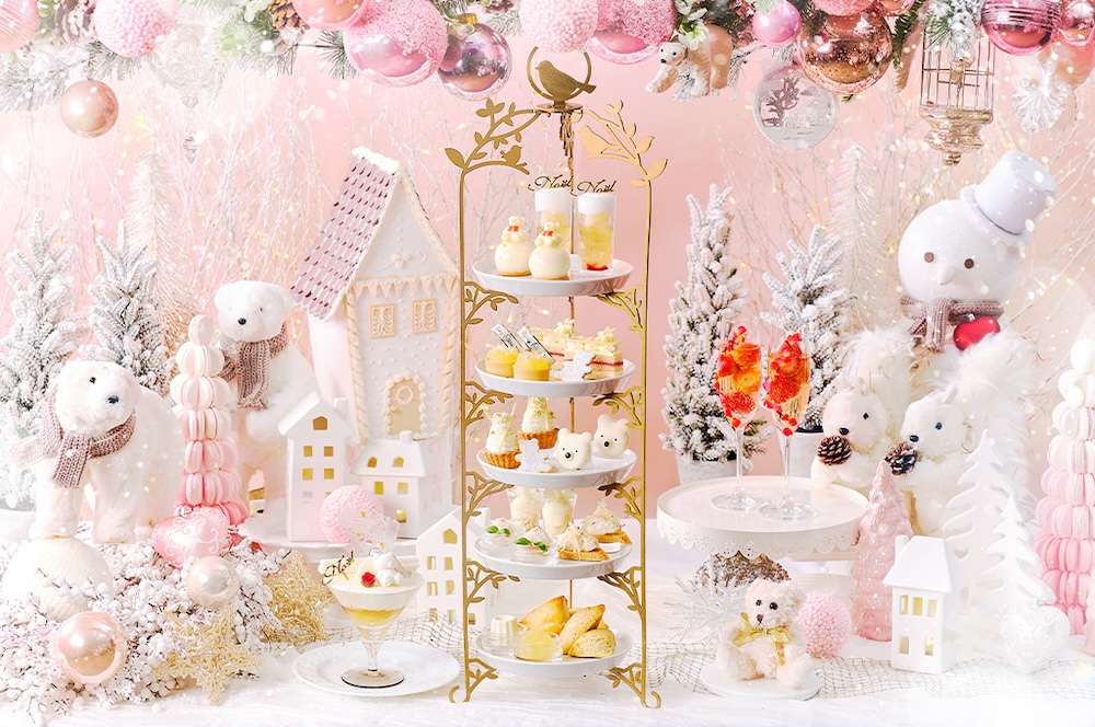 Pink and white desserts on a golden tray as part of Aoyama, Tokyo's Christmas-themed Afternoon Tea spread.